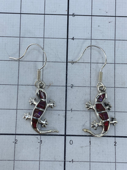 Aretes sobre superficie blanca mostrando el tamaño de 3.8 cm y el Quinto 950