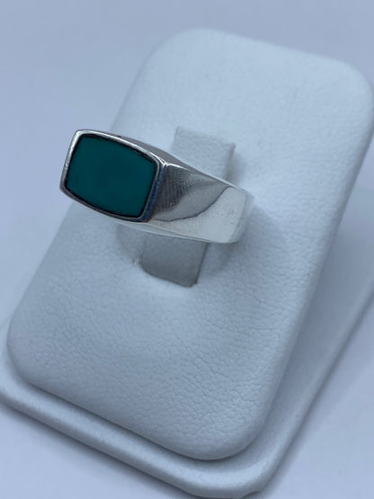 Anillo de plata turquesa azul, vista lateral mostrando el engaste a mano