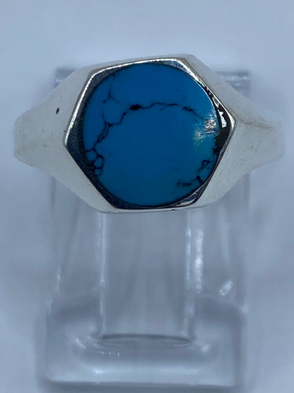 Anillo de plata con turquesa azul cielo engastada, vista frontal sobre fondo blanco