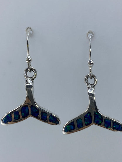 Aretes sobre regla centimetrica mostrando largo de 2.7 cm
