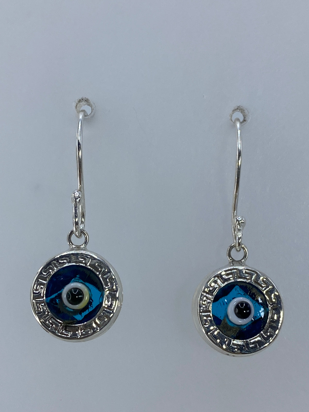 Par de aretes de plata 925 con piedra azul cielo y motivo prehispánico circular