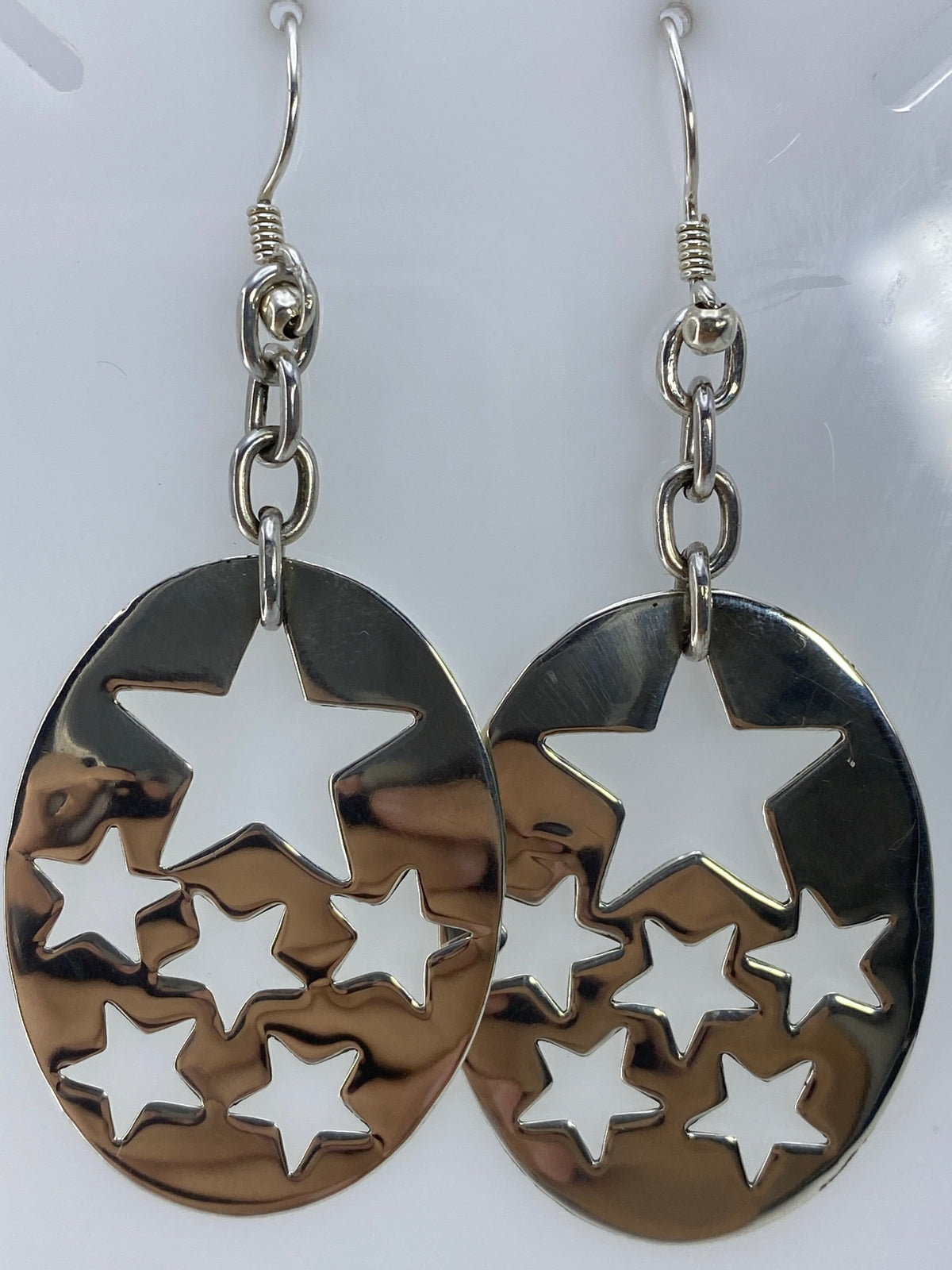 Par de aretes de plata 925 en calado con estrellas grandes y pequeñas recortadas en óvalo
