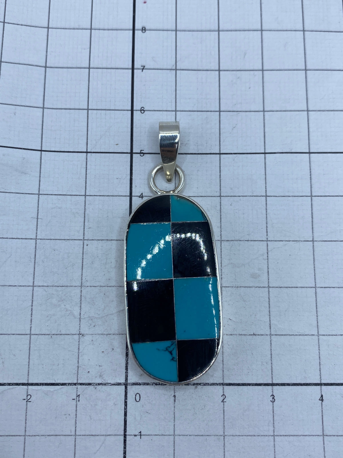 Reverso del dije con marcas 925 MEXICO y hallmark visible