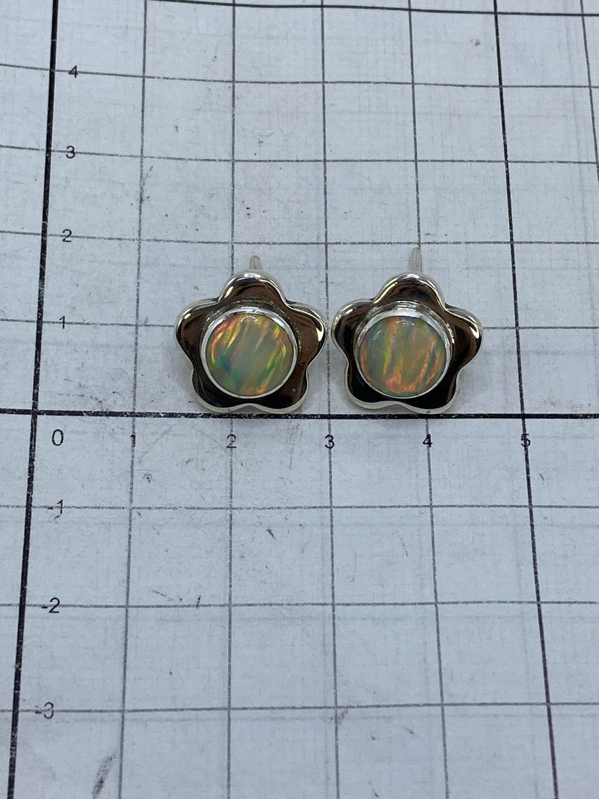 Reverso de los aretes mostrando el Quinto 950 y el hallmark de Taxco