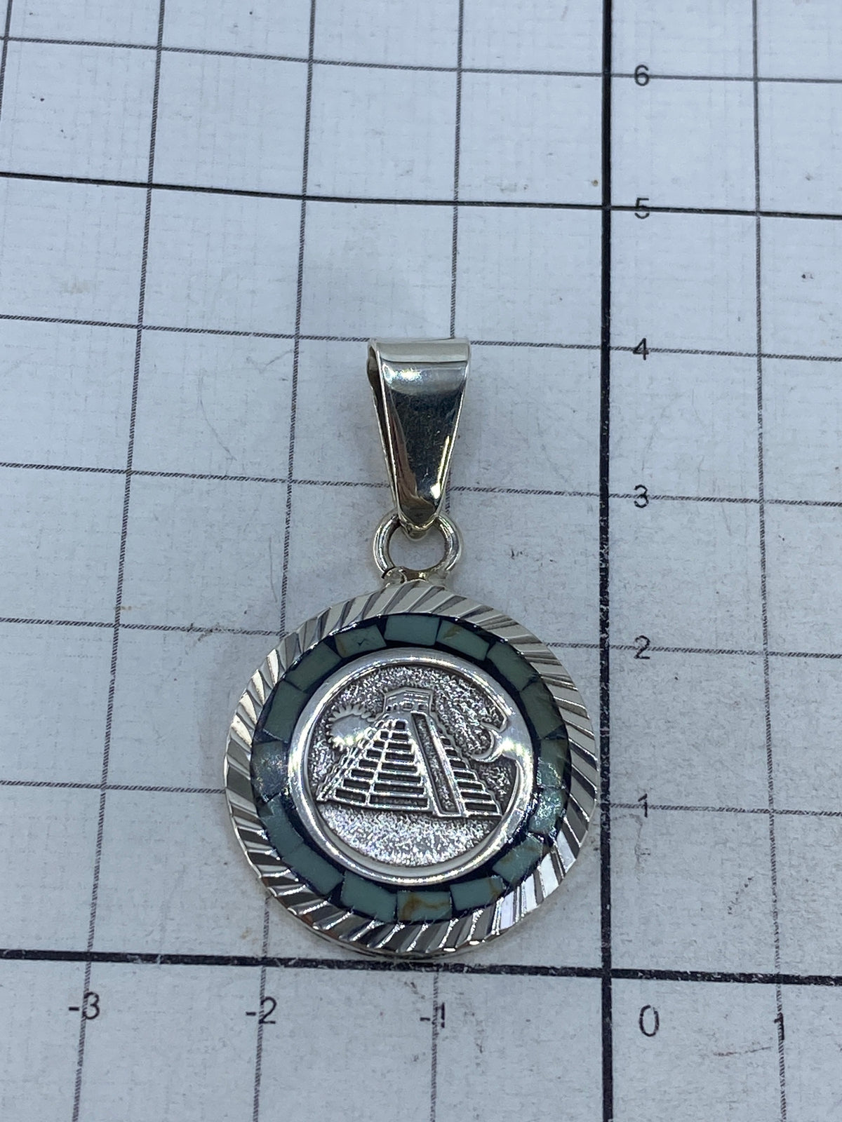 Reverso del dije con marca de autenticidad 925 y firma de Taxco
