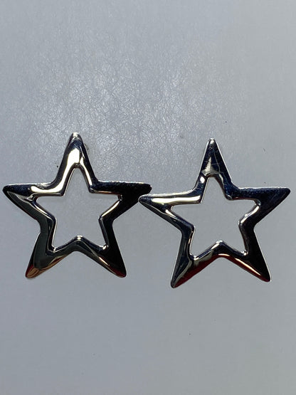Aretes de plata 925 en forma de estrella abierta, par completo, vista frontal