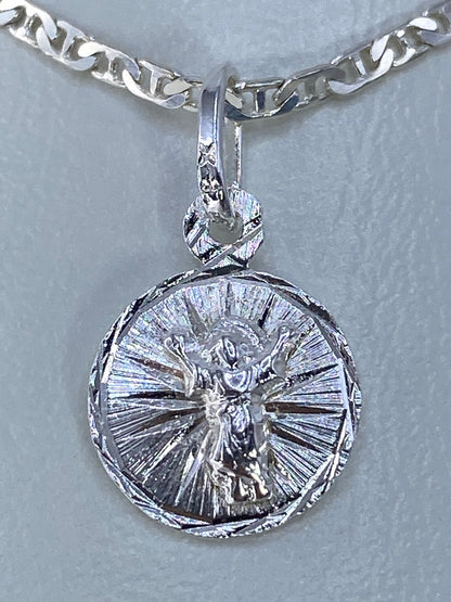 Dije cruz de plata 925 repujada a mano, 2 cm de largo, visto de frente