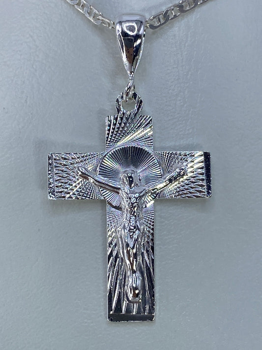 Dije cruz de plata 925 con Cristo crucificado repujado a mano, halo radial