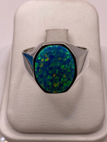 Anillo con Ópalo de Fuego Azul‑Verde Ovalado en Plata Ley 950